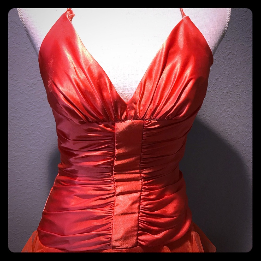 orange rouged prom dress with floor length ruffles